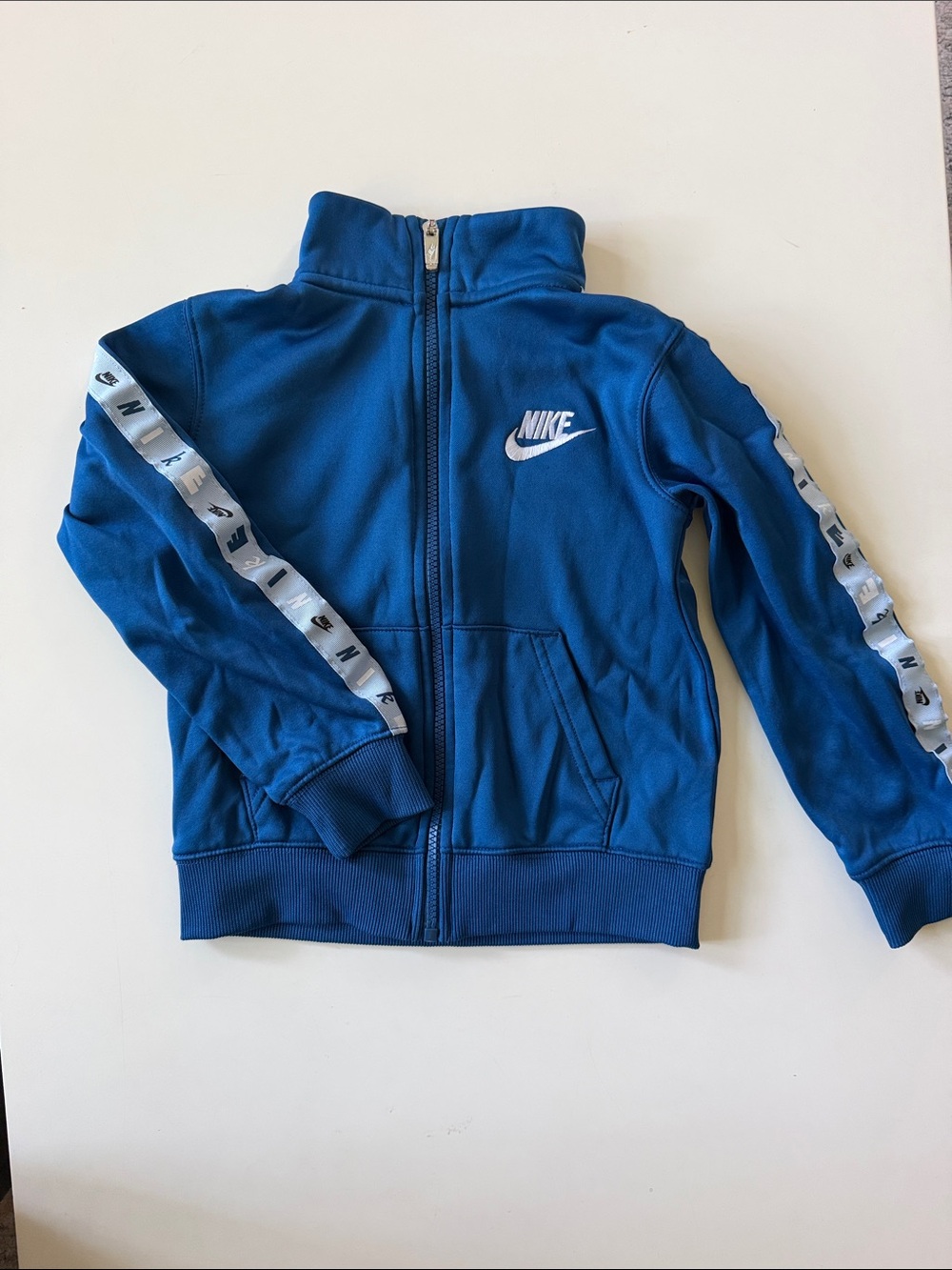 Nike Blue Kids Full-Zip Hoodie with White Logo and Sleeve Tape
